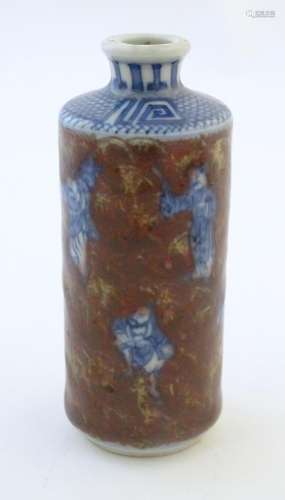 A Chinese snuff bottle with blue and white figures…