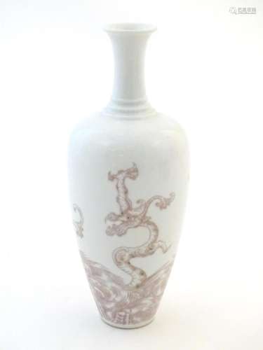 A Chinese vase decorated with a dragon amongst sty…