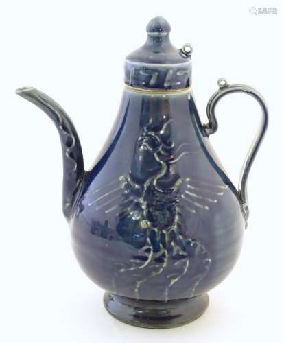 A Chinese pear shaped teapot with phoenix bird dec…