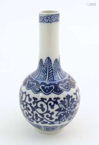 A small Chinese blue and white bottle vase with st…