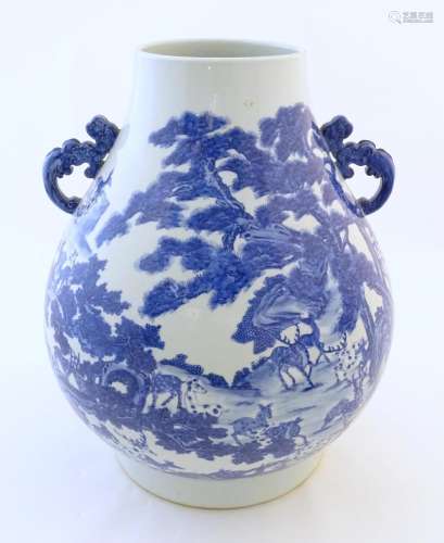 A large Chinese Hu vase with scrolled twin handles…