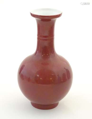 A Chinese bottle vase with a flared rim. Character…