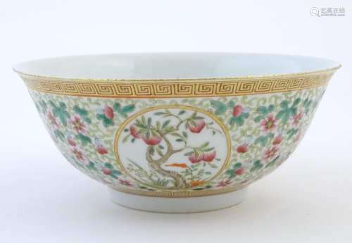 A Chinese famille verte bowl decorated with fruiti…