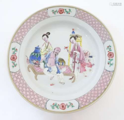 A Chinese famille rose plate decorated with an int…