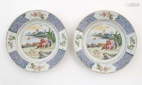 A pair of Chinese plates depicting a two figures i…