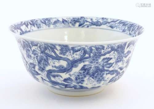 A Chinese blue and white bowl decorated with vine …