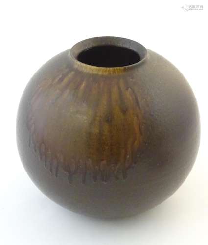 A Japanese vase of globular form with a drip glaze…