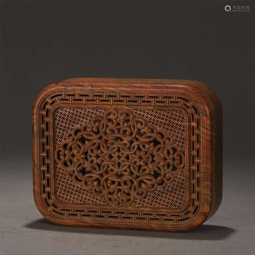 A Hollow Carved Wood Box and Cover