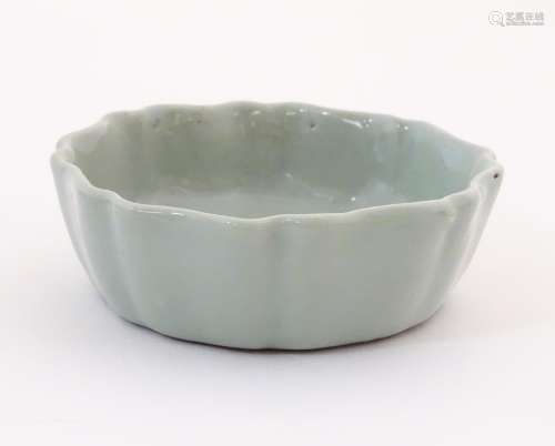 A Chinese celadon brush wash pot with a scalloped …