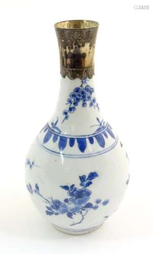 An Oriental blue and white bottle vase with silver…