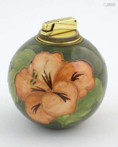 A Moorcroft table lighter of spherical form decora…