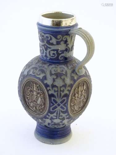 A 19thC German salt glazed stoneware jug by Merkel…