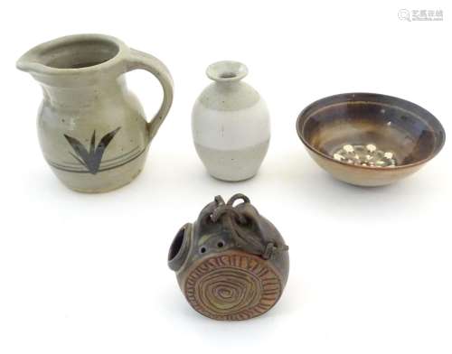 Four assorted studio pottery wares comprising a fl…