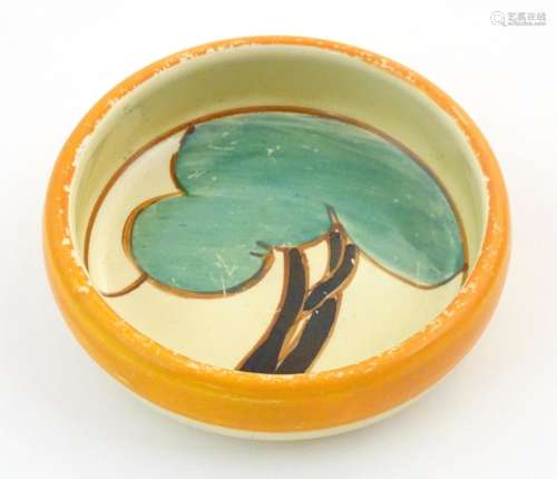 An Art Deco dish of circular form with hand painte…