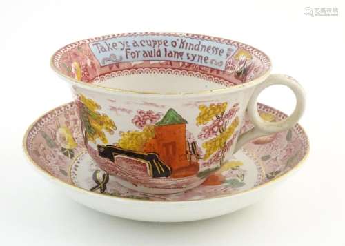 An oversized Burslem cup and saucer decorated with…