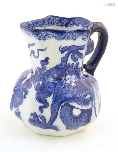 A small Royal Doulton blue and white jug in the Oy…