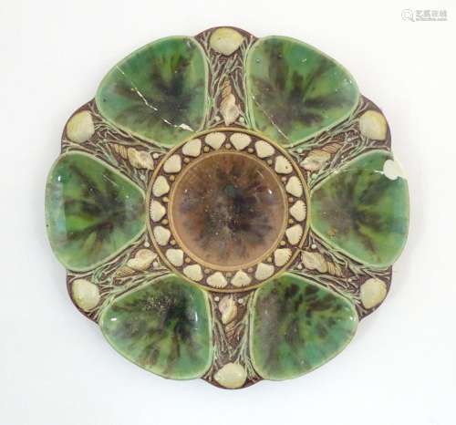 A Minton majolica oyster plate with relief shell d…