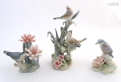 Three Lladro models of birds with flowers, compris…