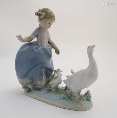 A Lladro figure of a girl with ducks, Hurry Now, m…