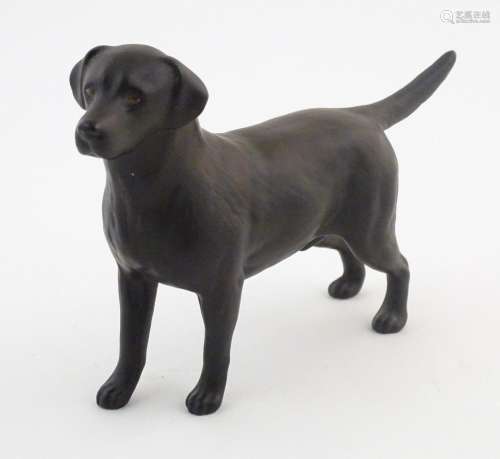 A Beswick matte model of a black labrador dog, mod…