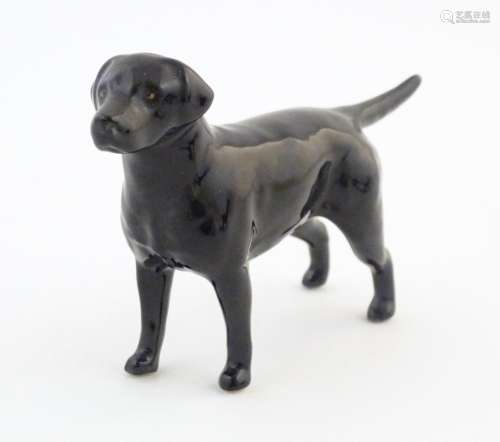 A Beswick model of a black labrador dog, model no.…