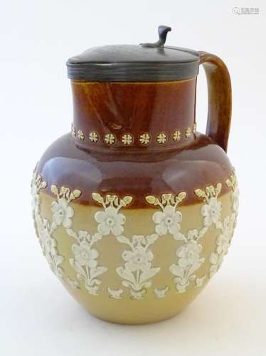 A Doulton Lambeth two tone jug with relief floral …