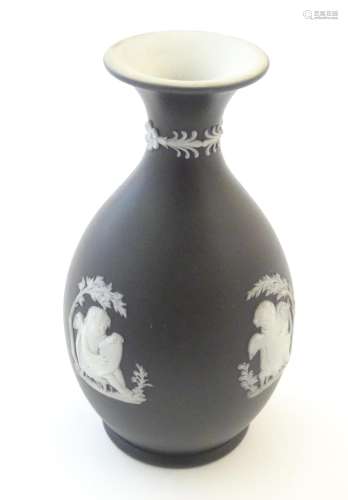 A small Wedgwood Etruria black jasperware vase dec…