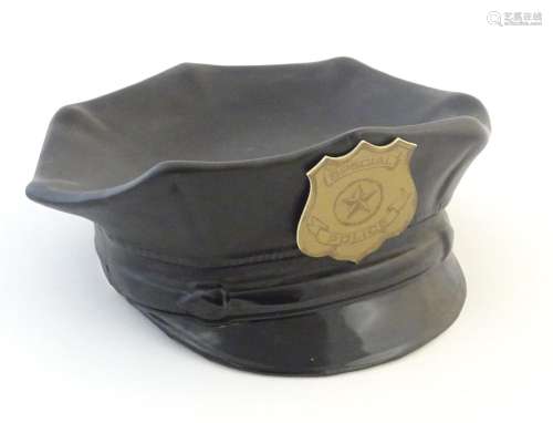 A novelty ceramic bowl / dish modelled as a Police…