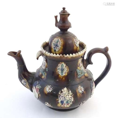 A large Victorian treacle glazed bargeware teapot …