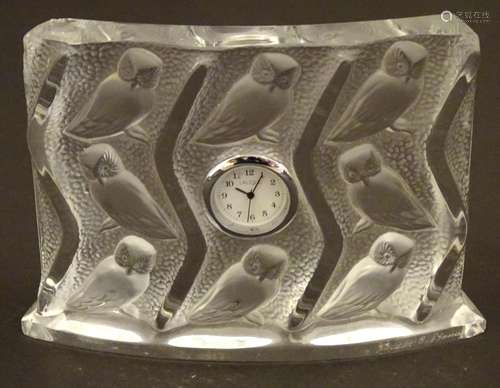 A Lalique mantle clock, the glass surround decorat…