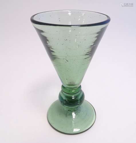 A green glass of conical form with top to stem and…