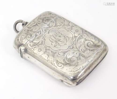 A silver vesta case with engraved decoration. hall…