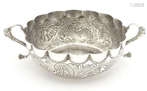 A Portuguese silver twin handled bowl with embosse…