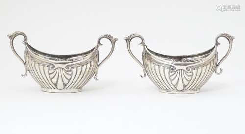 A pair of Victorian silver slats with twin handles…