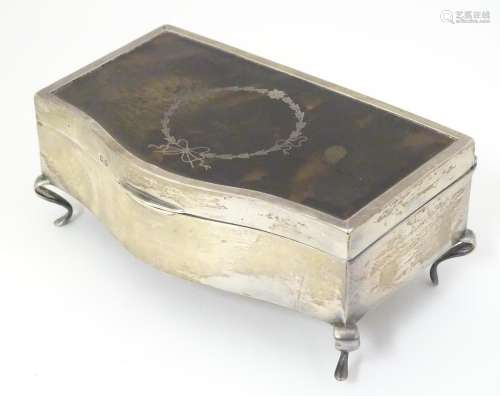 A dressing table box / jewellery box with silver, …