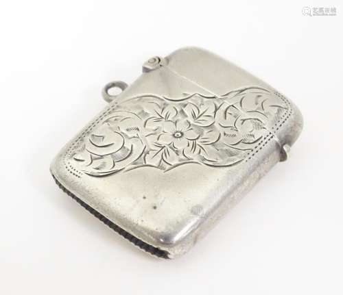 A Victorian silver vesta case with engraved decora…