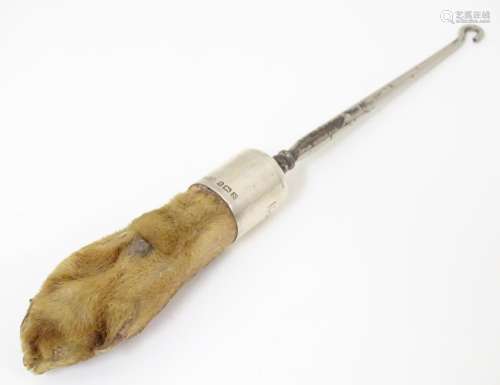 Taxidermy : A button hook, the handle formed as an…