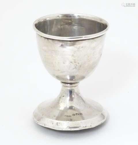 A silver egg cup hallmarked Birmingham 1931 maker …