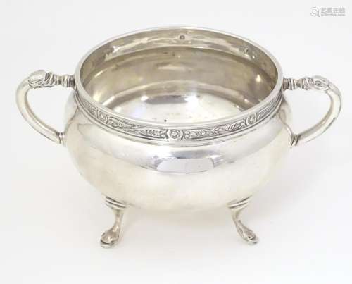 A silver twin handled porringer / bowl with Celtic…