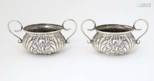 A pair of Victorian silver salts with twin handles…