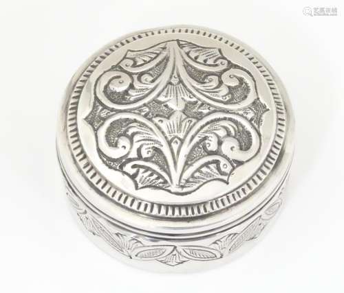 A white metal pot and cover with acanthus scroll d…