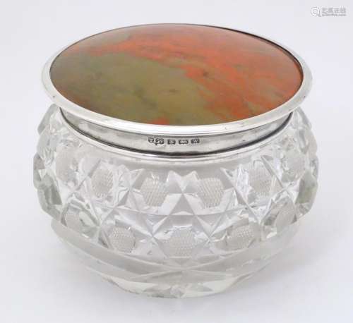 A cut glass dressing table jar with silver mounted…