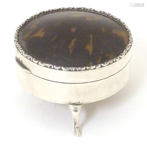 A silver ring box with tortoiseshell domed lid and…