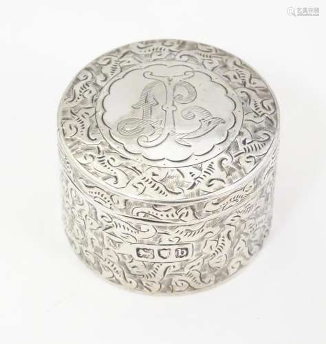 A Victorian silver pill box of circular form with …