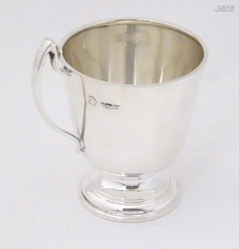 A silver christening mug, hallmarked Sheffield 197…
