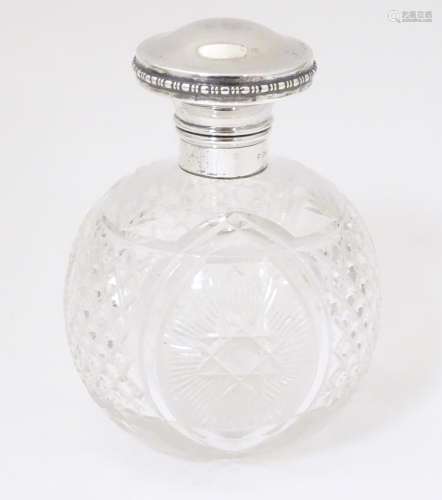 A cut glass scent / perfume bottle with mount and …