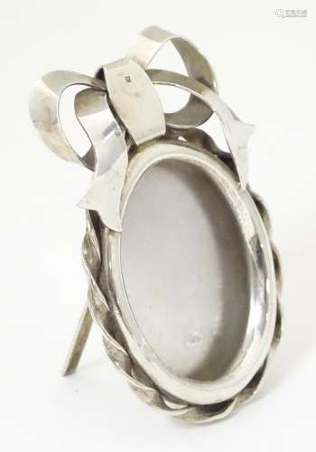 An Egyptian silver easel back photograph frame / p…