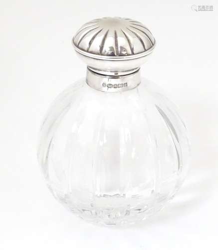 A glass scent / perfume bottle with silver mount a…