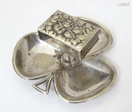 A silver plate ashtray of shamrock form with raise…