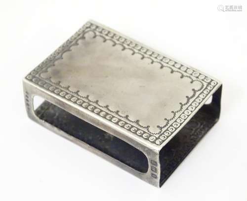 A silver match box cover with engraved decoration,…